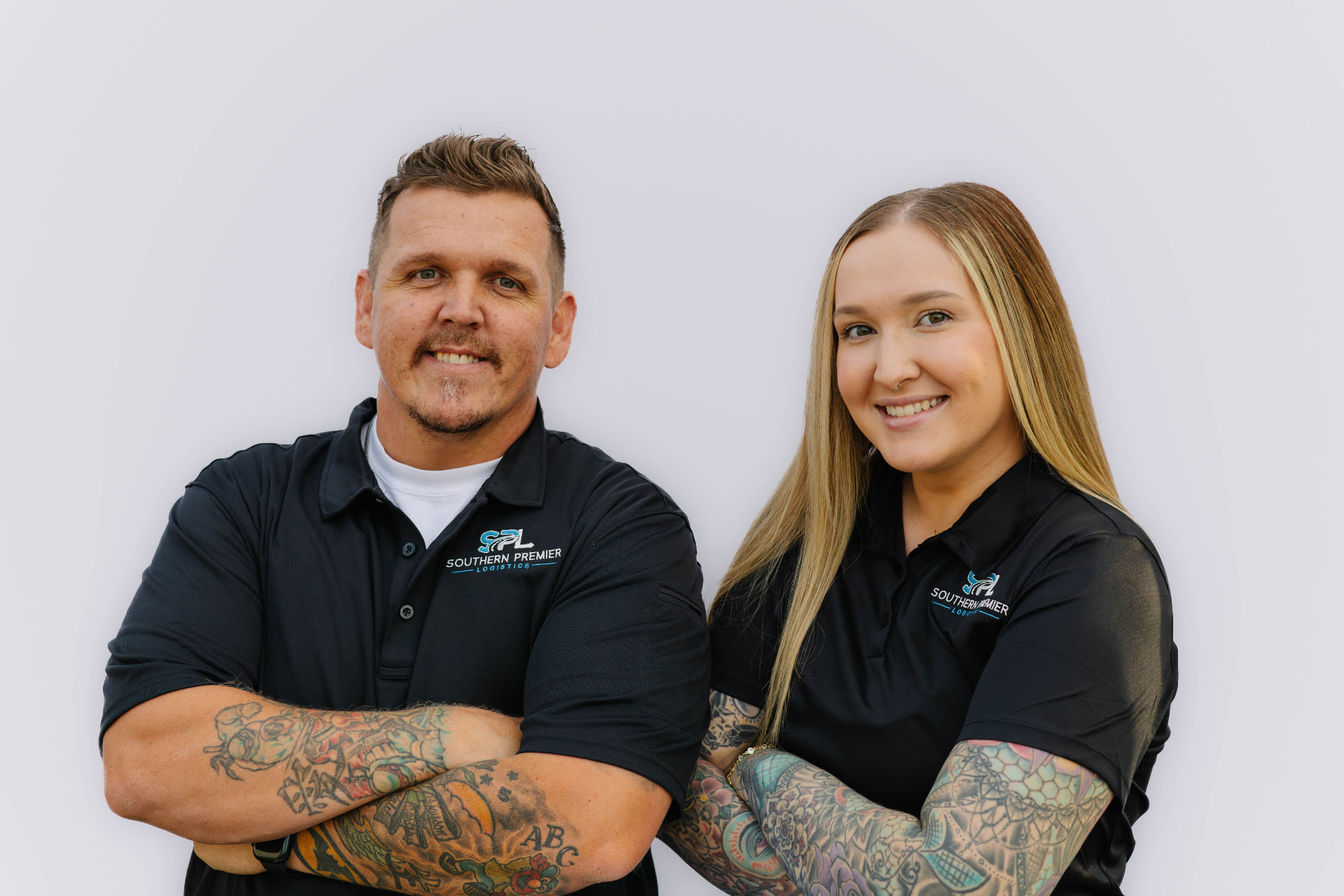 Almir Ponjevic and Alma Ponjevic of Southern Premier Logistics standing together in company polos